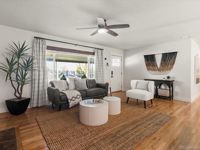 3560 S Glencoe St, Denver, CO 80237 - living area featuring ceiling fan, wood finished floors, and baseboards