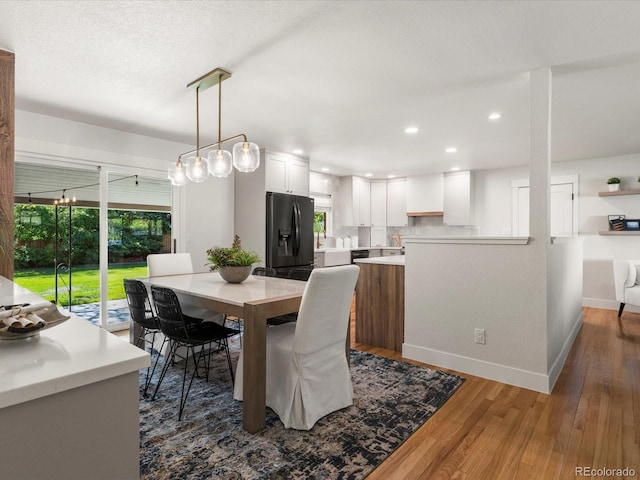 3560 S Glencoe St, Denver, CO 80237 - dining room with wood finished floors, recessed lighting, and baseboards