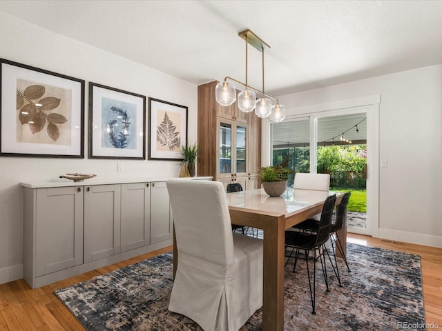 3560 S Glencoe St, Denver, CO 80237 - dining room featuring light wood-style flooring and baseboards