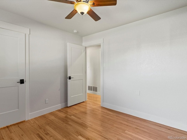 3560 S Glencoe St, Denver, CO 80237 - unfurnished bedroom featuring baseboards, light wood-style floors, and ceiling fan