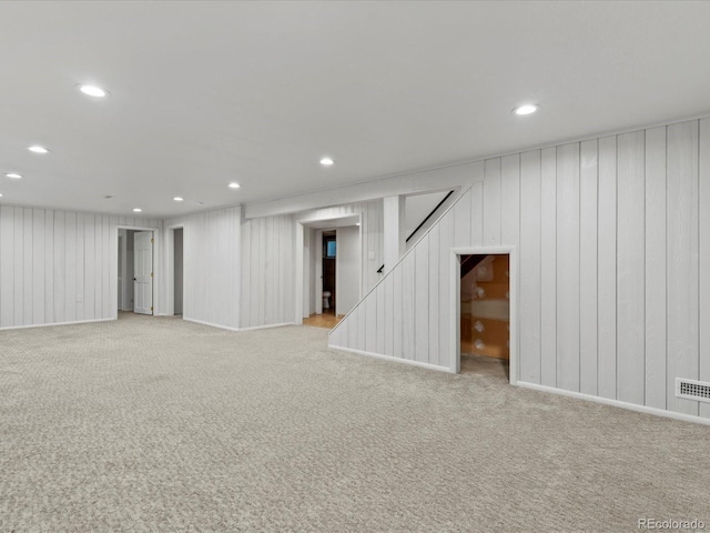 3560 S Glencoe St, Denver, CO 80237 - finished basement featuring light colored carpet, recessed lighting, and stairway