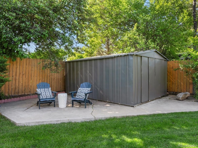 3560 S Glencoe St, Denver, CO 80237 - view of patio featuring a fenced backyard, an outbuilding, and a shed