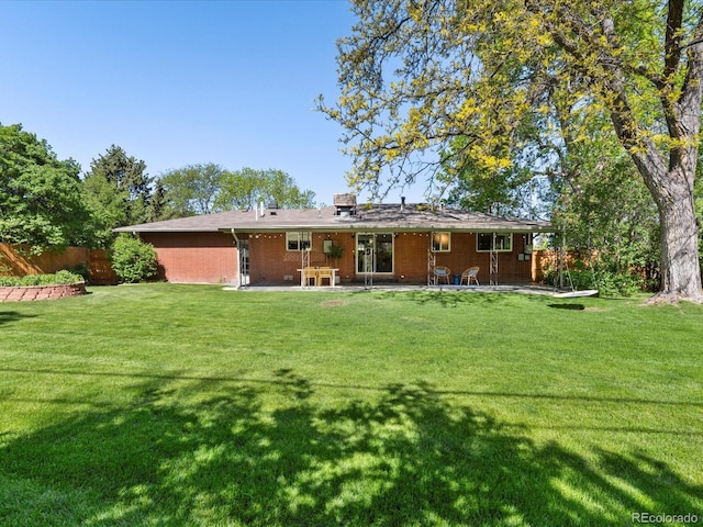 3560 S Glencoe St, Denver, CO 80237 - rear view of house with a patio and brick siding