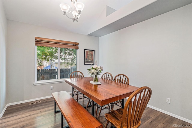6230 Snowberry Ave, Firestone, CO 80504 - dining area with a chandelier, dark wood-style flooring, and lofted ceiling