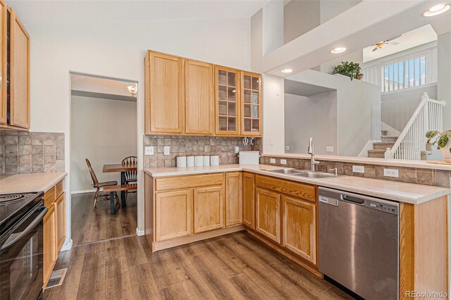 6230 Snowberry Ave, Firestone, CO 80504 - kitchen featuring dishwasher, electric range, a peninsula, dark wood finished floors, and tasteful backsplash