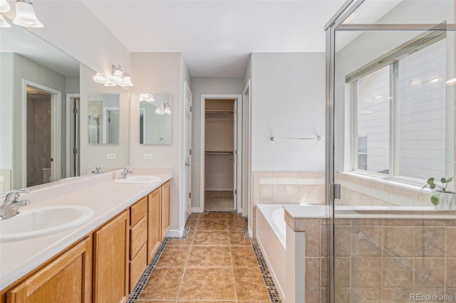 6230 Snowberry Ave, Firestone, CO 80504 - full bathroom featuring double vanity, a bath, and a tile shower