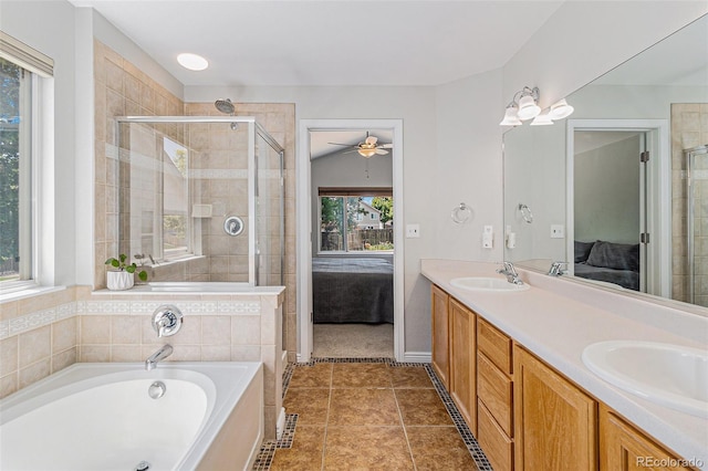6230 Snowberry Ave, Firestone, CO 80504 - ensuite bathroom featuring a ceiling fan, a garden tub, double vanity, and a stall shower