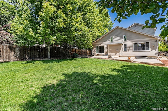 6230 Snowberry Ave, Firestone, CO 80504 - back of property featuring a patio and a fenced backyard