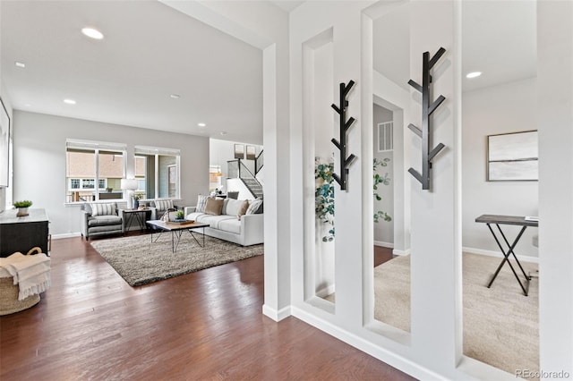 18180 W 84th Pl, Arvada, CO 80007 - living room with a barn door, stairway, wood finished floors, and recessed lighting
