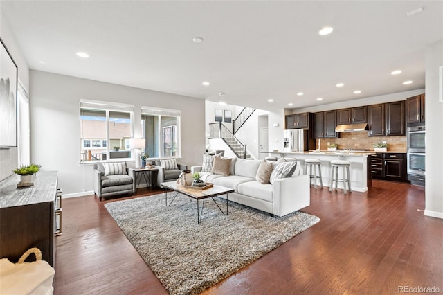 18180 W 84th Pl, Arvada, CO 80007 - living area featuring stairs, dark wood-style flooring, and recessed lighting