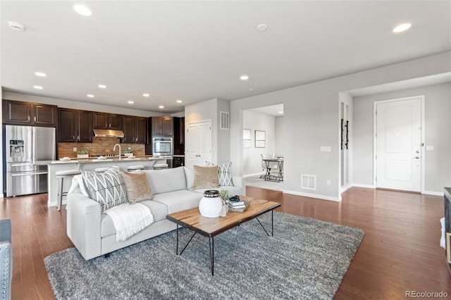 18180 W 84th Pl, Arvada, CO 80007 - living area featuring recessed lighting and dark wood finished floors