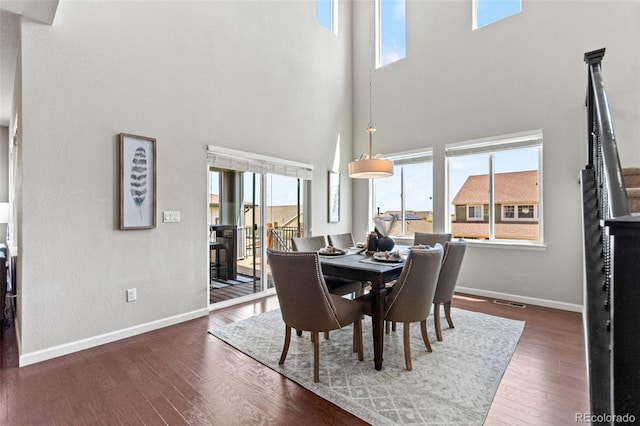 18180 W 84th Pl, Arvada, CO 80007 - dining area featuring a towering ceiling and wood finished floors