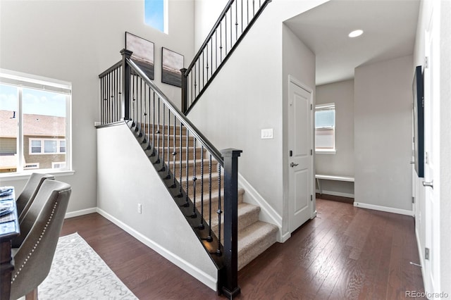18180 W 84th Pl, Arvada, CO 80007 - stairs with wood finished floors, a high ceiling, and recessed lighting