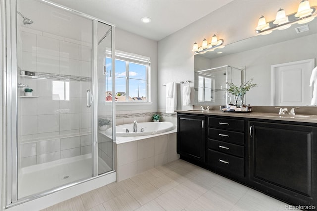 18180 W 84th Pl, Arvada, CO 80007 - bathroom featuring double vanity, a bath, and a stall shower