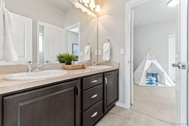 18180 W 84th Pl, Arvada, CO 80007 - bathroom featuring double vanity and tile patterned floors