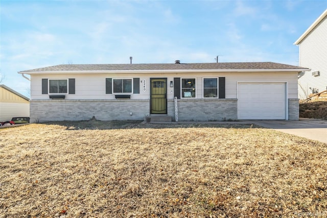 2240 Flintwood Dr, Colorado Springs, CO 80910 - ranch-style house featuring brick siding, an attached garage, driveway, and a front yard