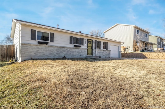 2240 Flintwood Dr, Colorado Springs, CO 80910 - view of front facade featuring brick siding and a garage