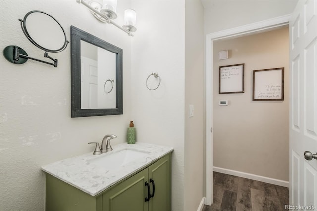 2240 Flintwood Dr, Colorado Springs, CO 80910 - bathroom with wood finished floors and vanity