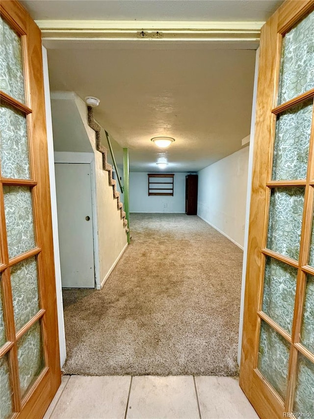 hallway with carpet flooring