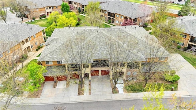 birds eye view of property with a residential view