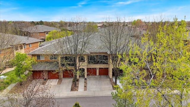 view of front of property with driveway and a garage
