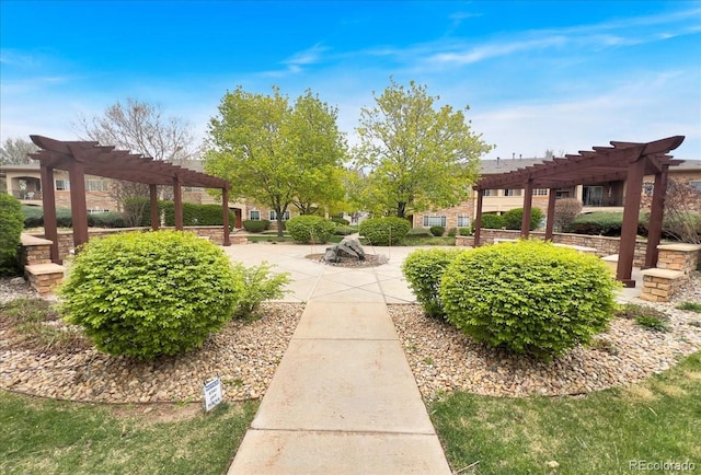 view of home's community featuring a patio area and a pergola
