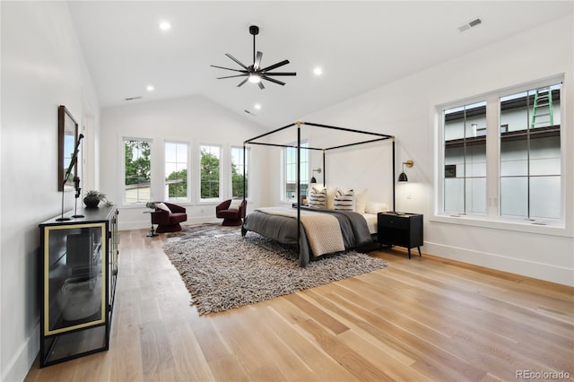 bedroom featuring light hardwood / wood-style floors and vaulted ceiling