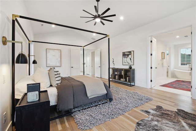 bedroom featuring connected bathroom, ceiling fan, lofted ceiling, and hardwood / wood-style flooring