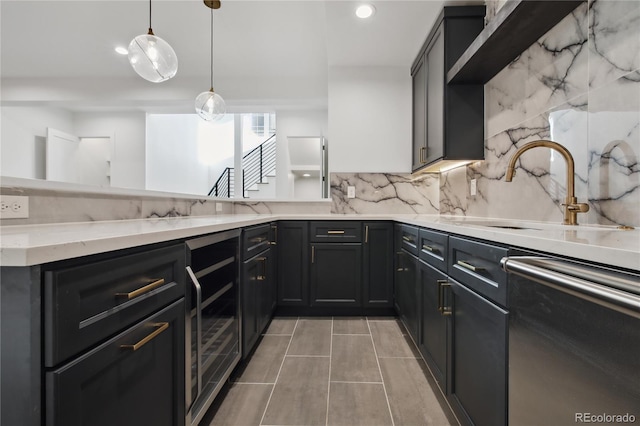 kitchen with dishwasher, sink, beverage cooler, backsplash, and decorative light fixtures