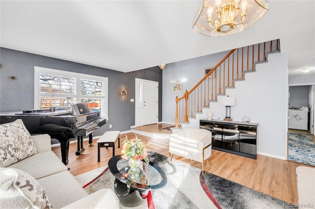 living room featuring hardwood / wood-style floors and a notable chandelier