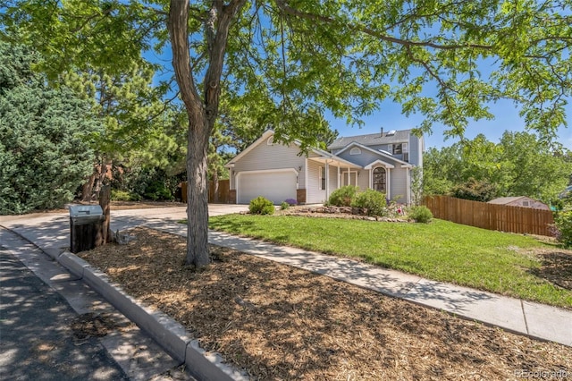 1826 Palm Dr, Colorado Springs, CO 80918 - view of front of home with an attached garage and driveway