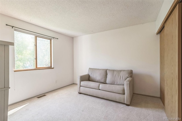 1826 Palm Dr, Colorado Springs, CO 80918 - living area with carpet flooring and a textured ceiling