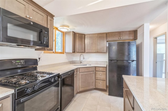 1826 Palm Dr, Colorado Springs, CO 80918 - kitchen with black appliances, light countertops, and light tile patterned flooring