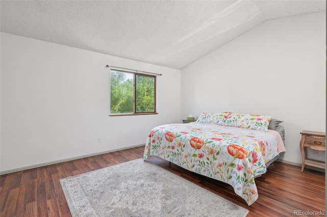 1826 Palm Dr, Colorado Springs, CO 80918 - bedroom featuring lofted ceiling, wood finished floors, and a textured ceiling