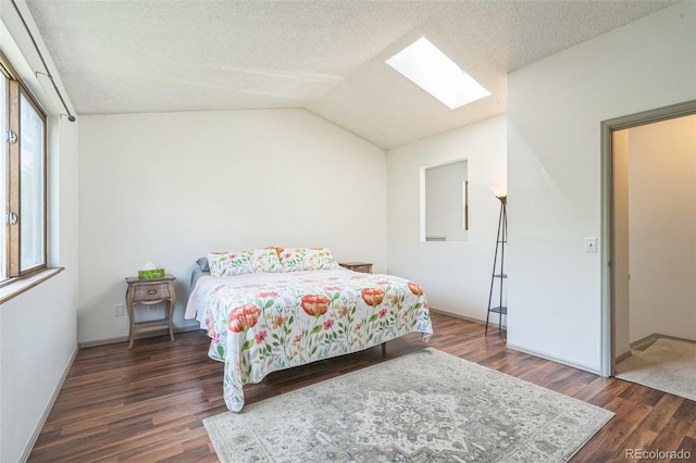 1826 Palm Dr, Colorado Springs, CO 80918 - bedroom featuring a skylight, wood finished floors, and lofted ceiling