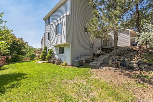 1826 Palm Dr, Colorado Springs, CO 80918 - rear view of house featuring a lawn and stairway