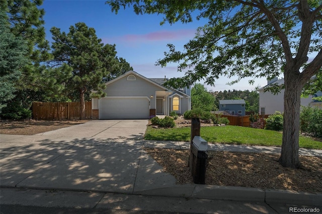 1826 Palm Dr, Colorado Springs, CO 80918 - ranch-style house with concrete driveway, an attached garage, and brick siding