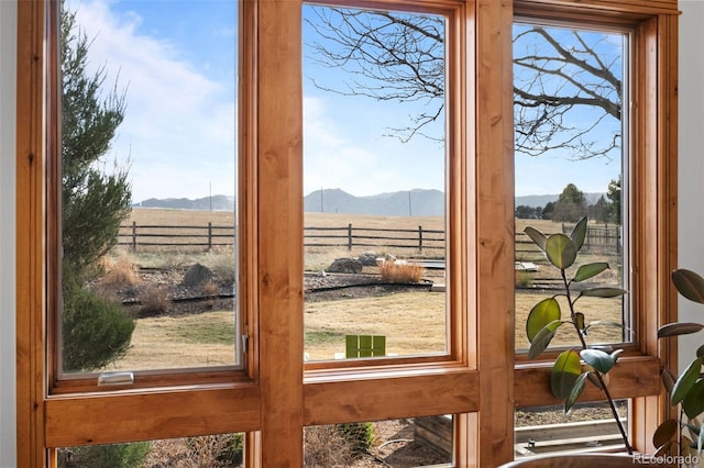 doorway to outside featuring a mountain view and a rural view
