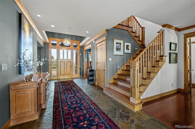 entrance foyer featuring stairway, baseboards, recessed lighting, and stone tile flooring