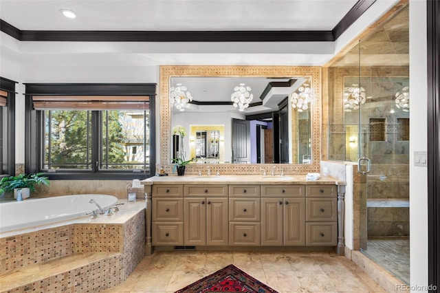bathroom with crown molding, a sink, a garden tub, and a stall shower