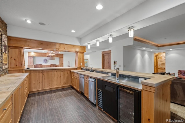 kitchen with light countertops, recessed lighting, open floor plan, a peninsula, and wine cooler