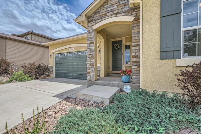 view of exterior entry featuring a garage