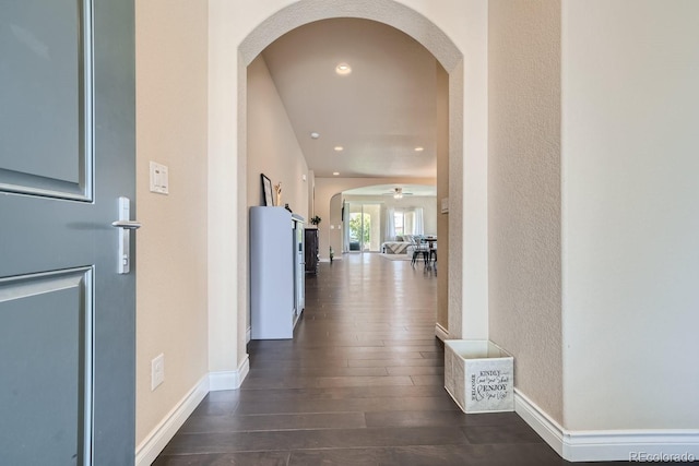 hallway with dark hardwood / wood-style floors