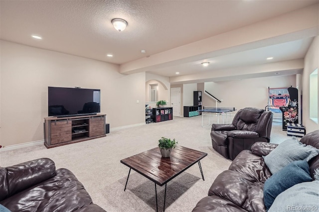 carpeted living room with a textured ceiling