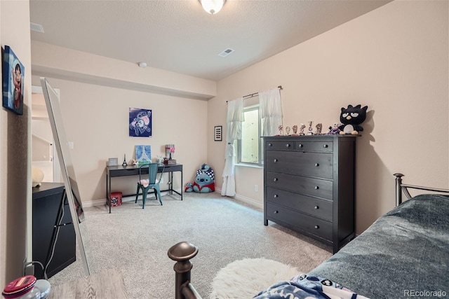 bedroom featuring light colored carpet