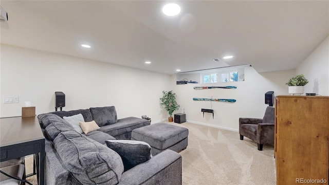 living room with light carpet, baseboards, and recessed lighting