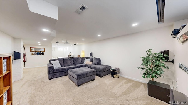 living area with baseboards, carpet floors, visible vents, and recessed lighting