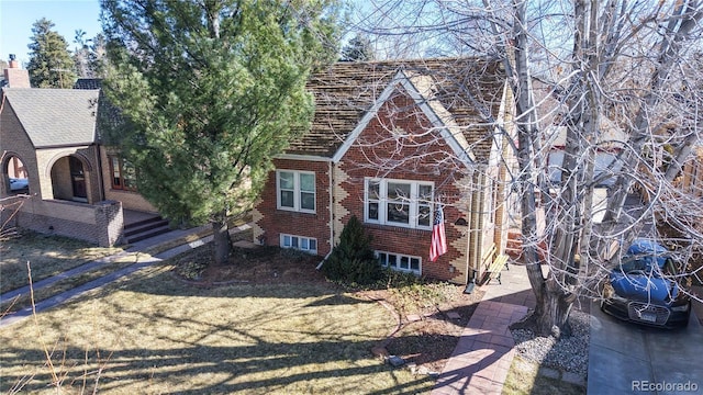 exterior space featuring brick siding