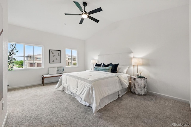 bedroom featuring carpet, vaulted ceiling, baseboards, and a ceiling fan