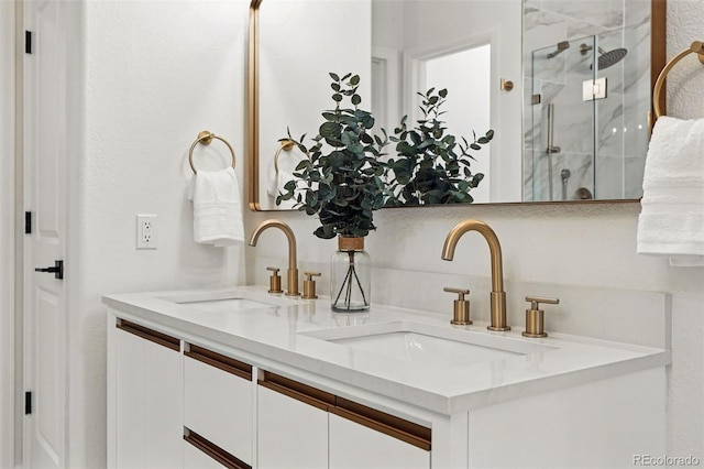 full bath featuring a shower stall and double vanity